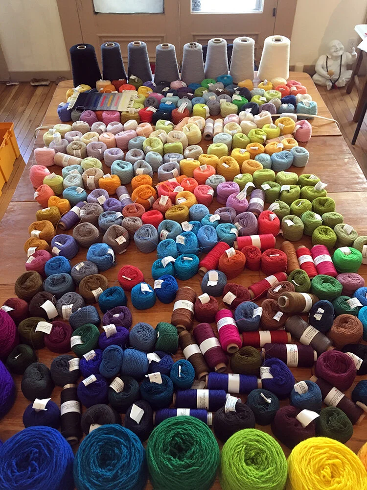 Yarn table arranged by value in color.