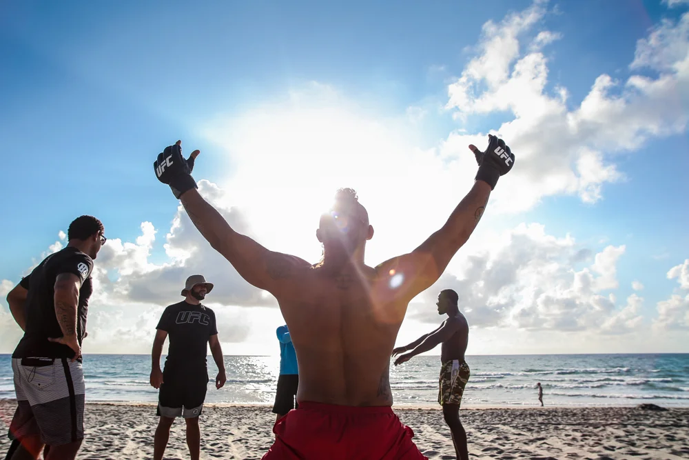 Before a morning workout on the beach in Boca Raton, FL, Vitor Belfort greets the sun.