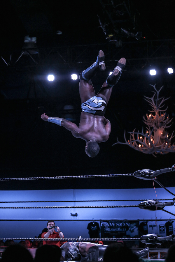 An independent wrestler in Las Vegas launches into the air for a moonsault.
