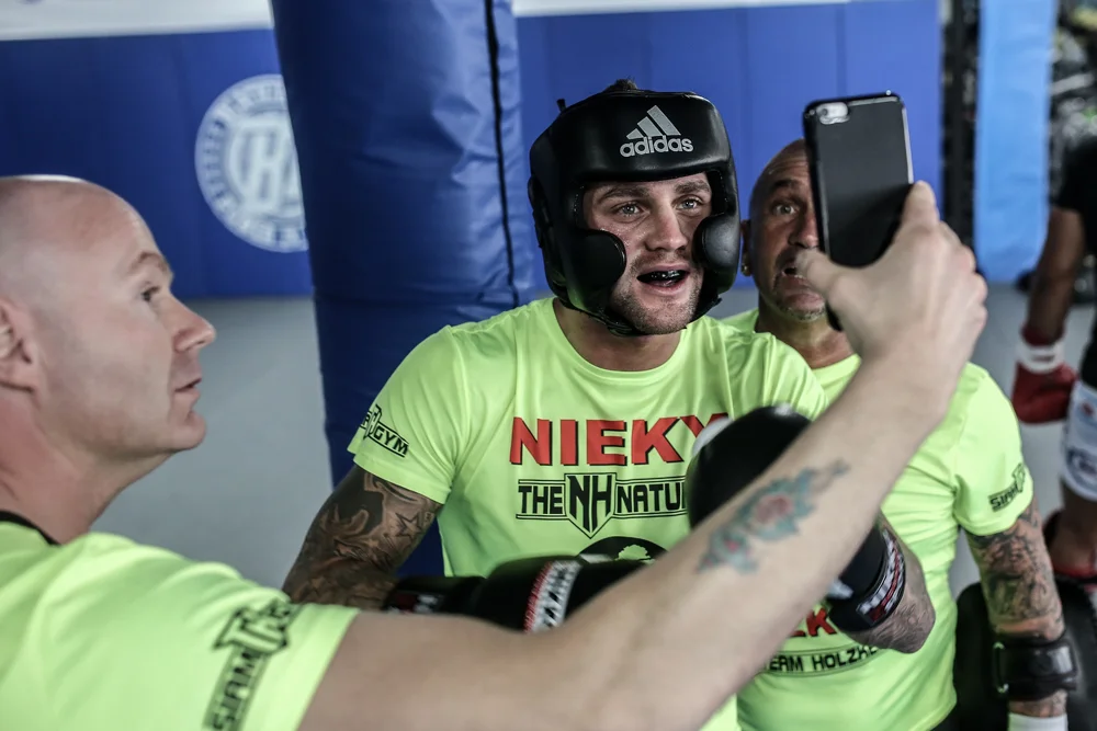 Glory champion Nieky Holzken takes a second out of training to Facetime with his baby.