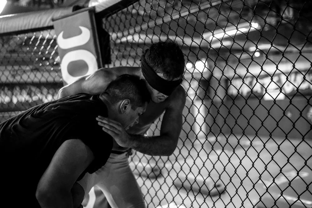 Yuri Villefort practices take down defense while blindfolded. 