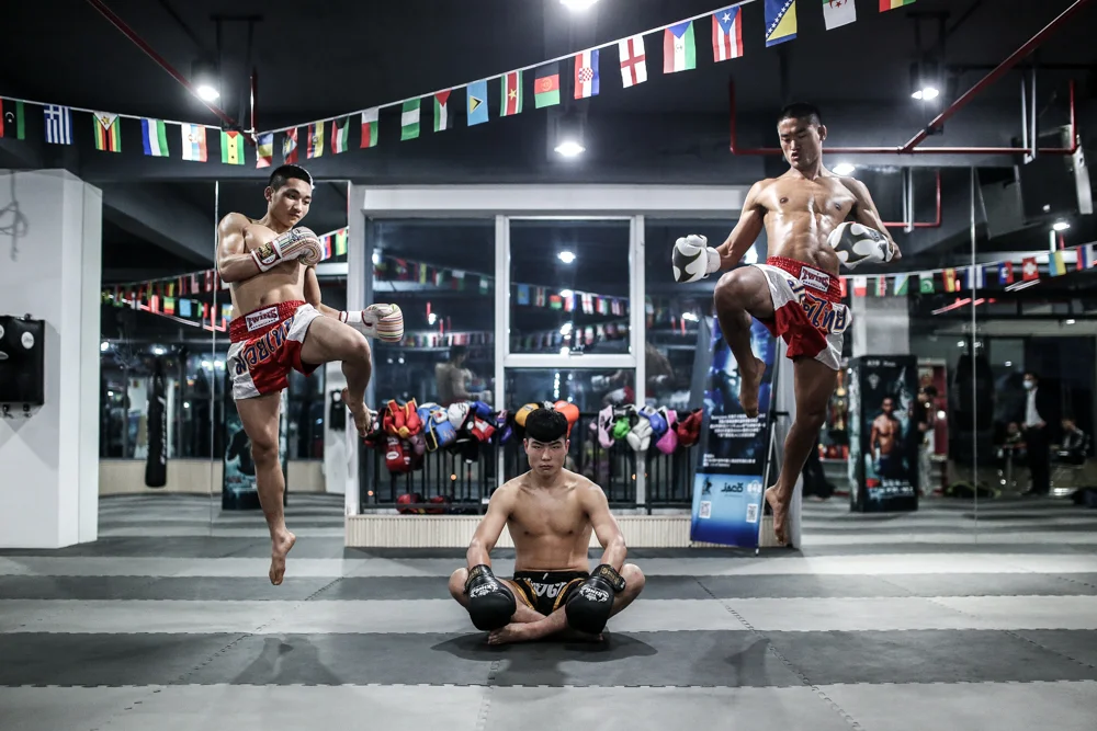 Three young prospects at their home gym in Chengdu, China.