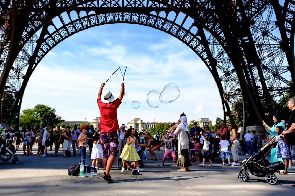 A street performer making bubbles for the kids in Paris, France.