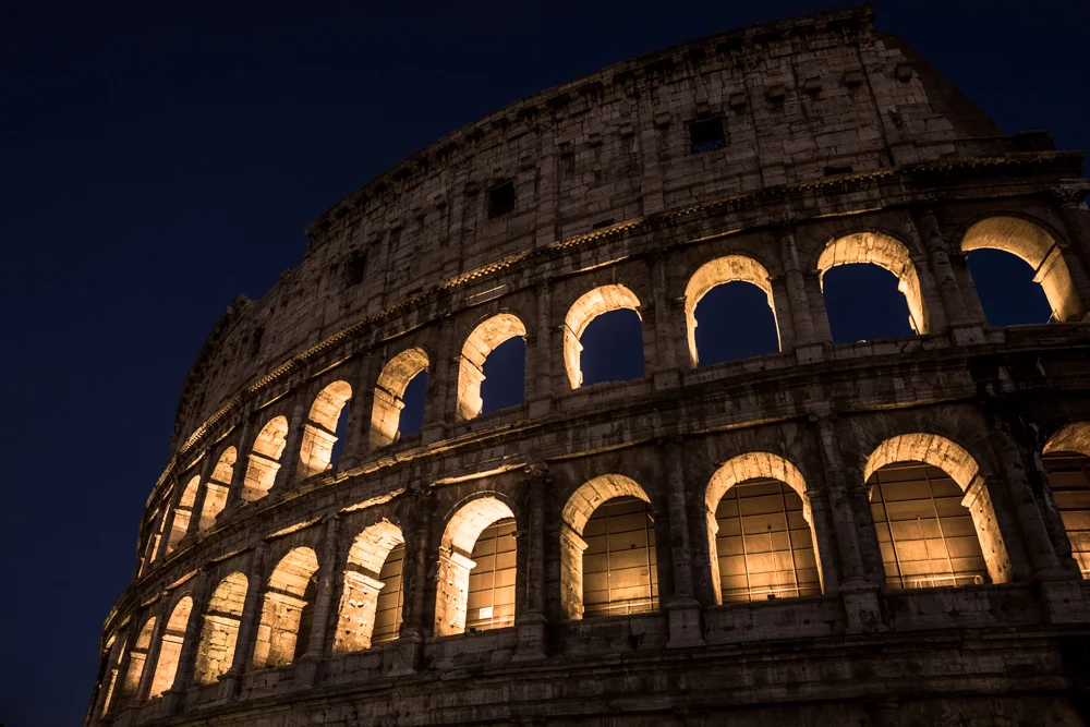 The Colosseum lit up in Rome, Italy.