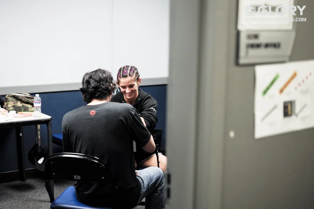 Tiffany Van Soest is all smiles as she gets her hands wrapped. 