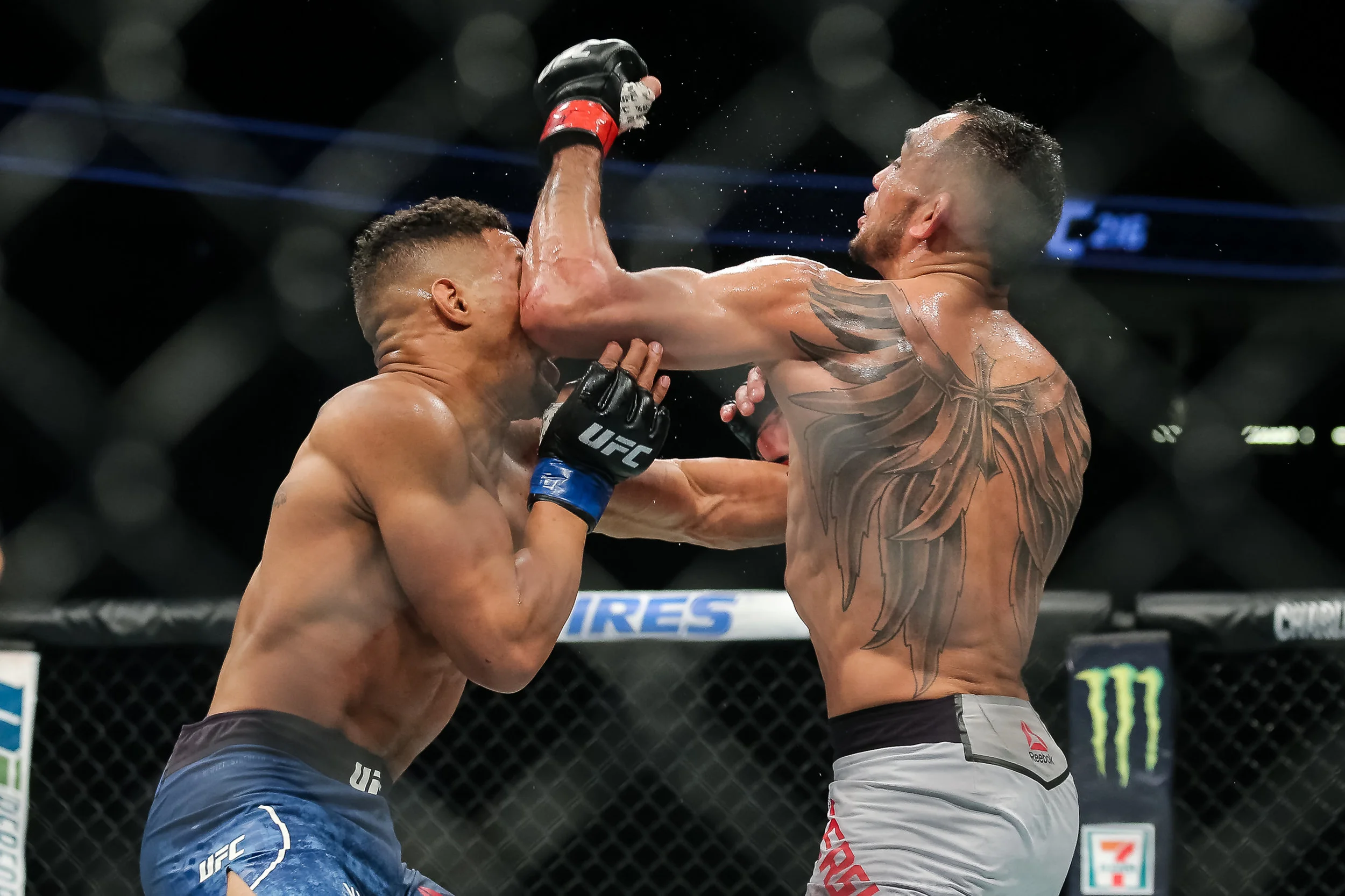 Tony Ferguson lands a big elbow against Kevin Lee, on his way to becoming the interim UFC lightweight champion.