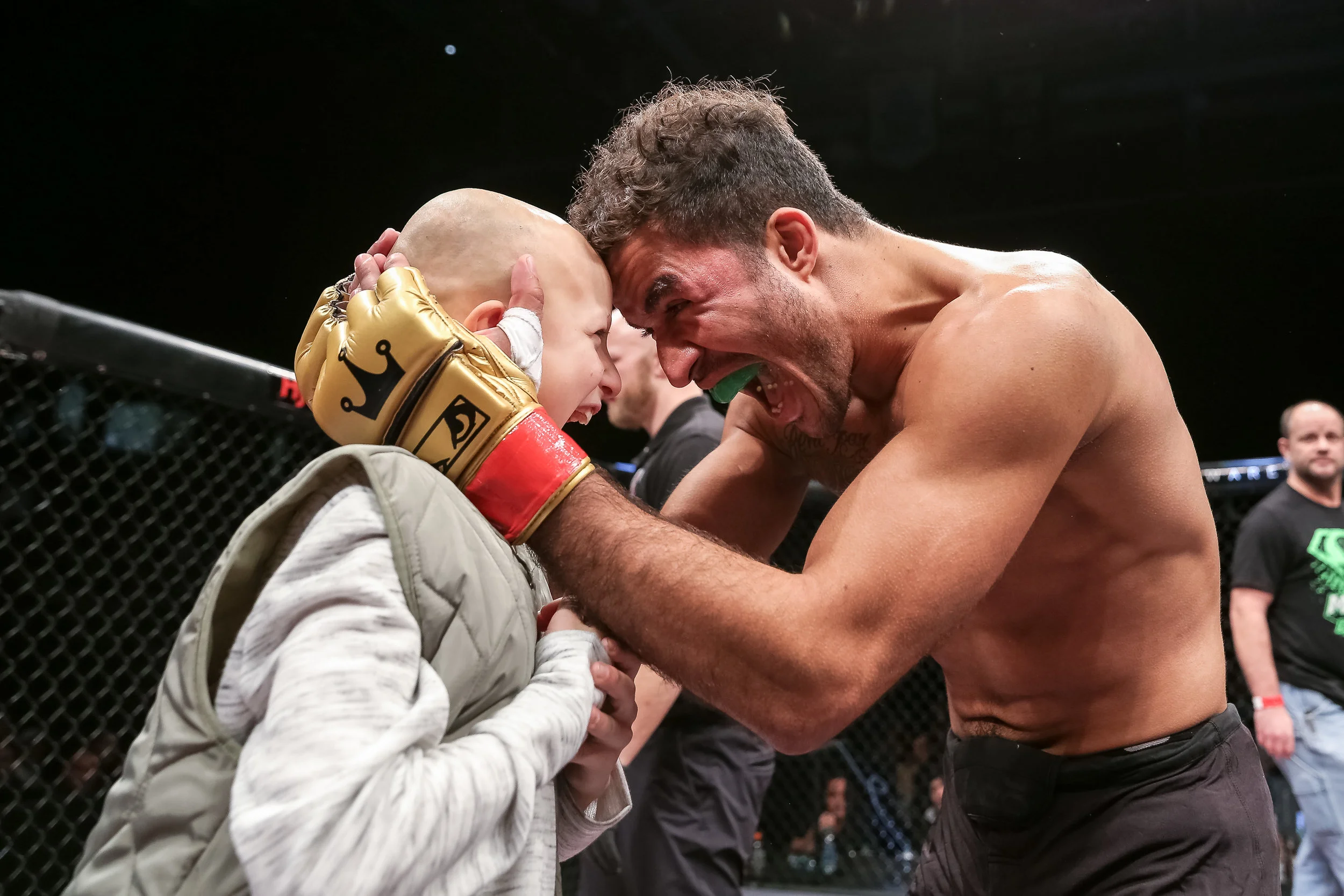 Yuri Villefort retains his VFC welterweight title and celebrates with Cash Halverson. 