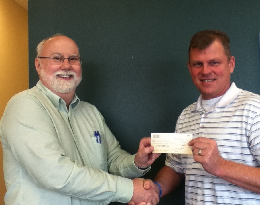 Kyle Pratt and and Bill Radtke with the check for book 3.