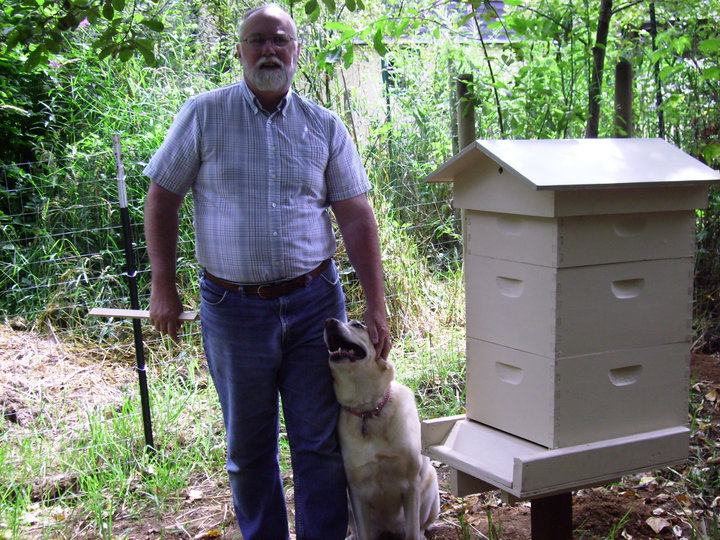 Kyle Pratt, his dog Nikki and the new hive boxes
