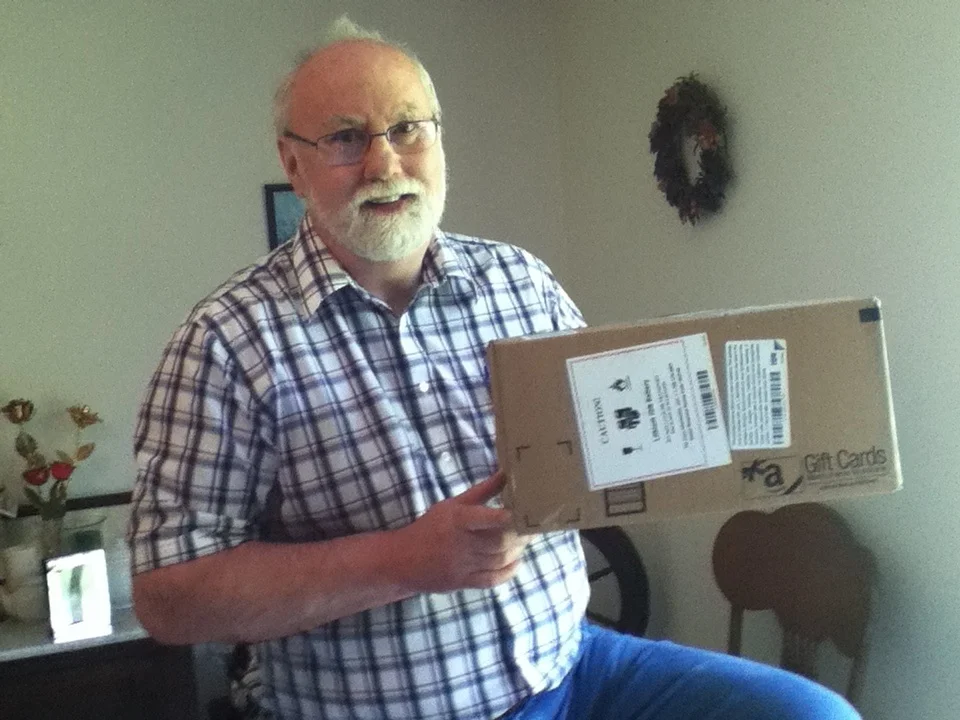 Kyle Pratt with a large but light box from Amazon