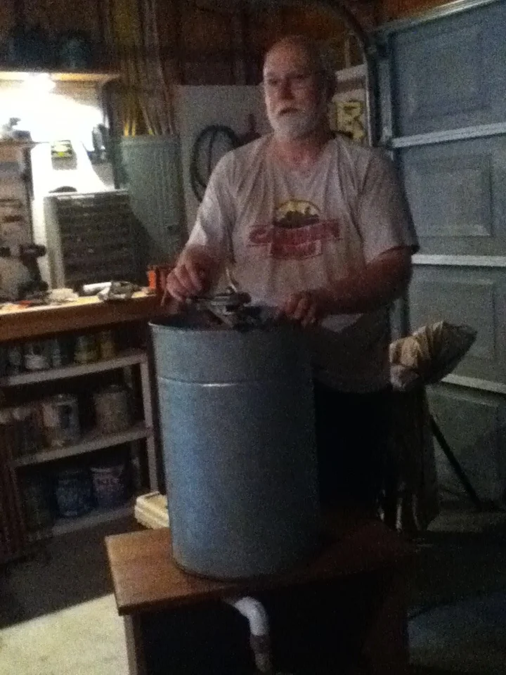 Kyle Pratt harvesting honey.