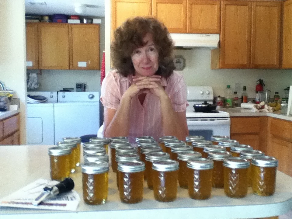 Lorraine Pratt looks over twenty pounds of honey.