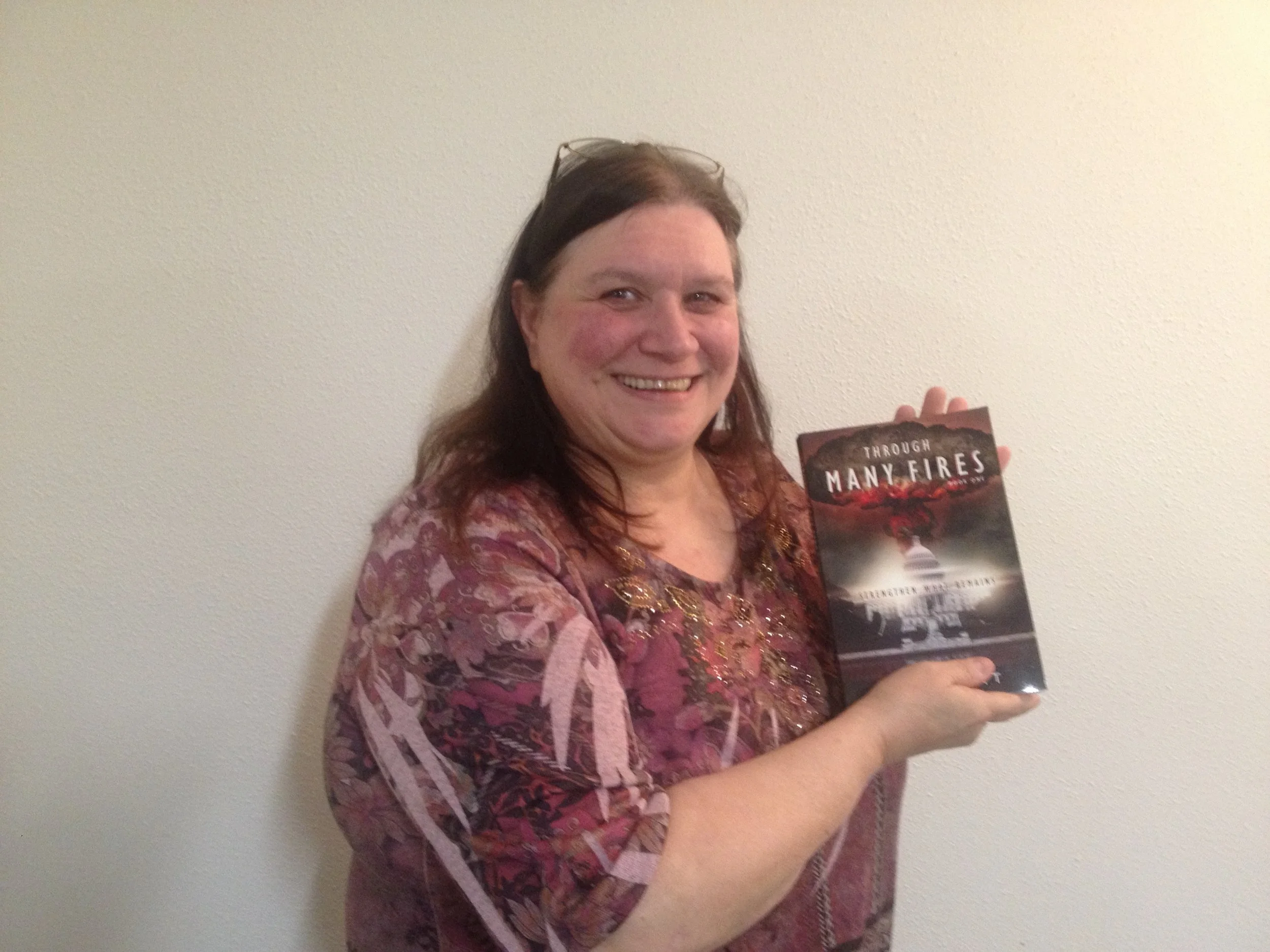 Debbie from Centralia, Washington State, with a copy of Through Many Fires.