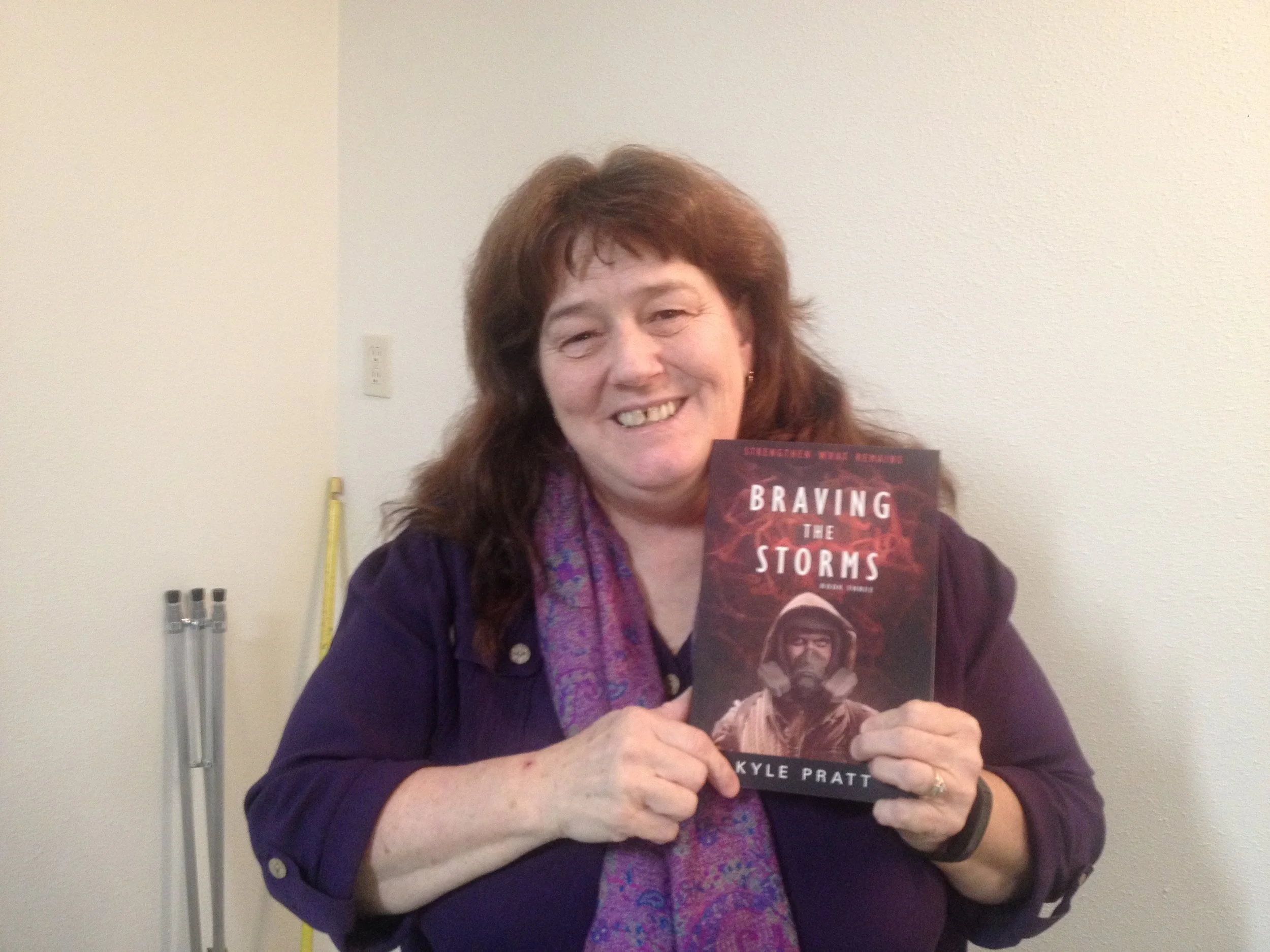 Julie from Toledo, Washington State, with a copy of Braving the Storms . She told me that she has already read Through Many Fires and A Time to Endure .