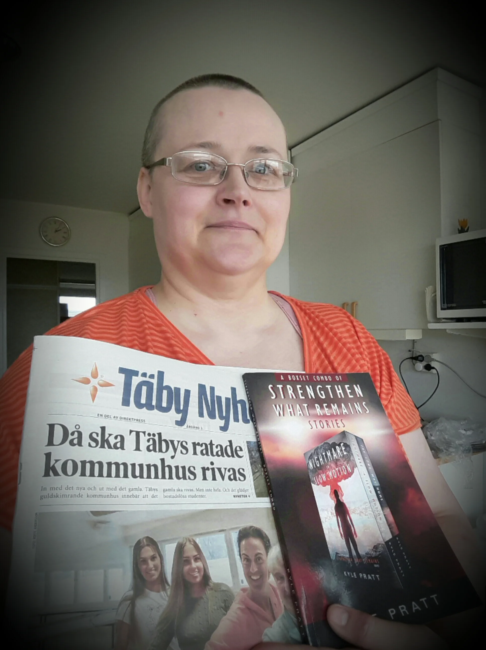 Karina from Sweden holds a copy of the combo book with Nightmare in Slow Motion and The Long Way Home .