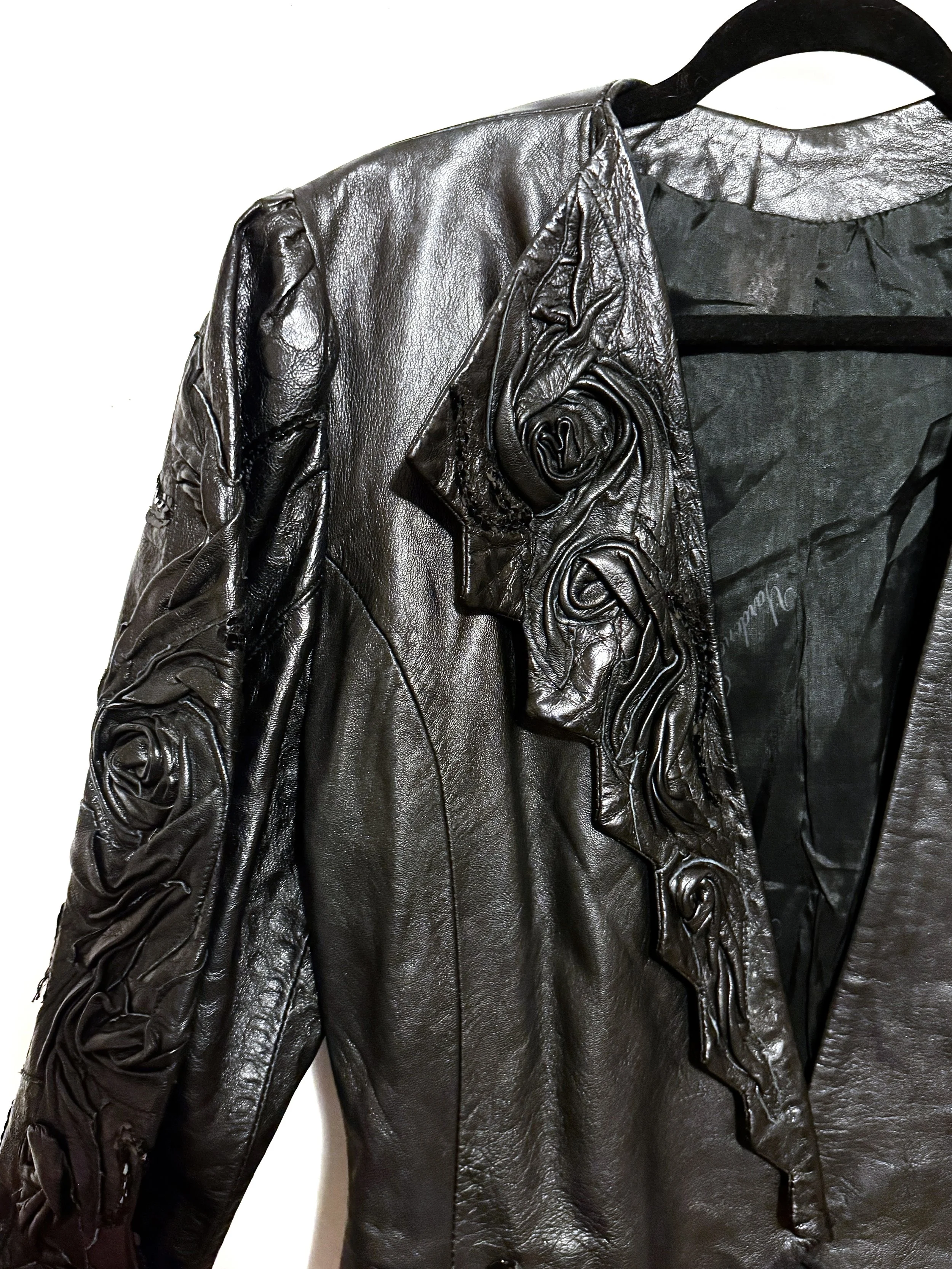VintageBlackleatherjacketwithfloralsculpteddetailCloseup.JPG