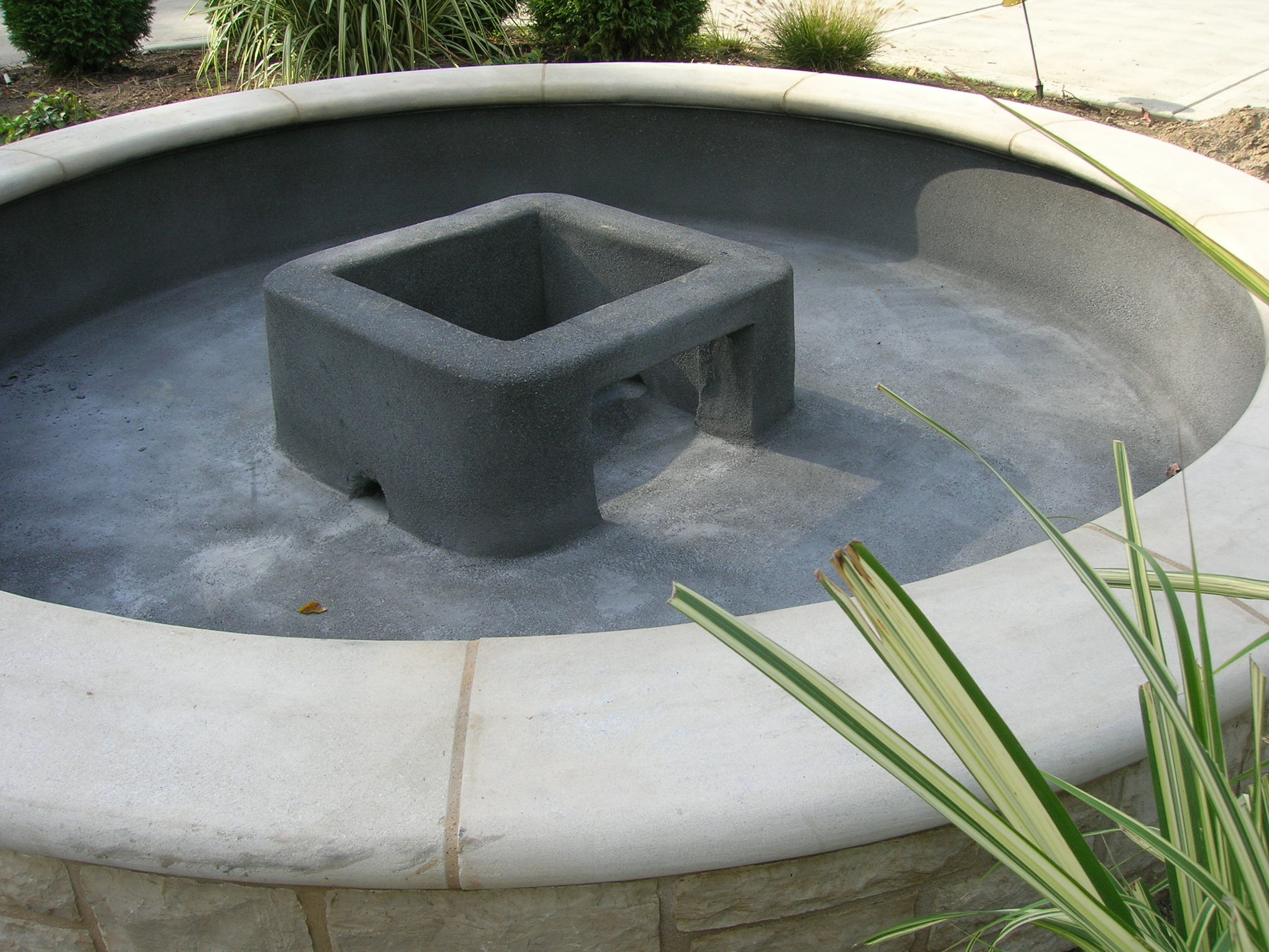 Concrete Fountain Base in a Fountain Pool