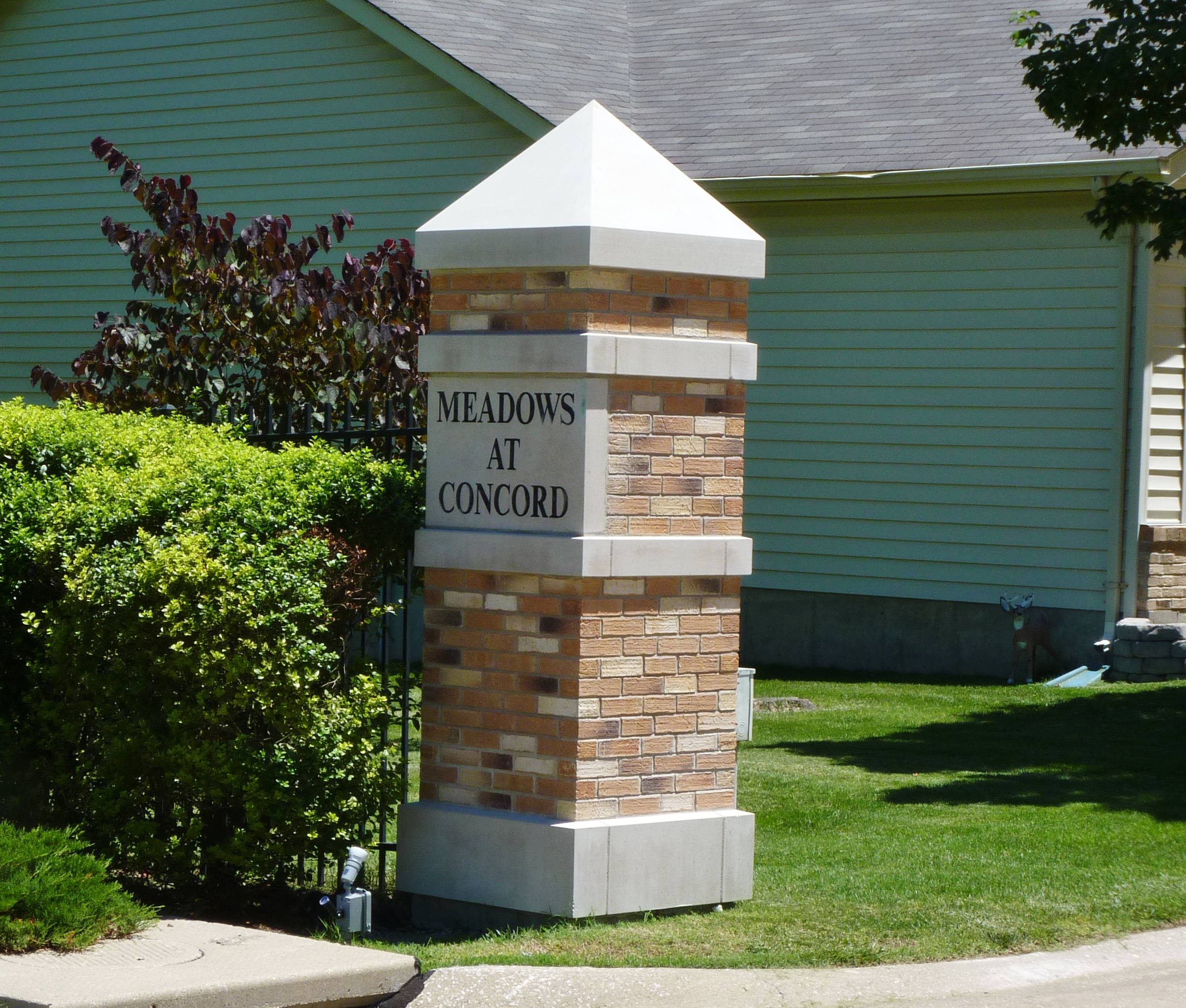 Pointed Stone Colmmn Cap on a Brick and Stone Entry Column