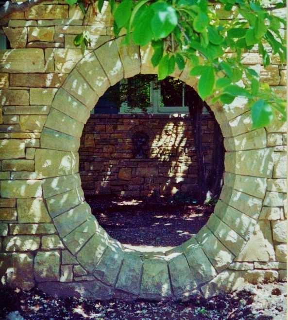 This stone moon gate is the entrance to a secret garden.  Stone Works  Lee Lindsey, St. Louis, MO