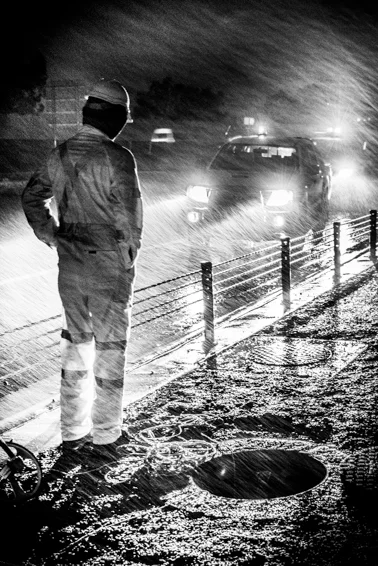 Construction workers in the rain