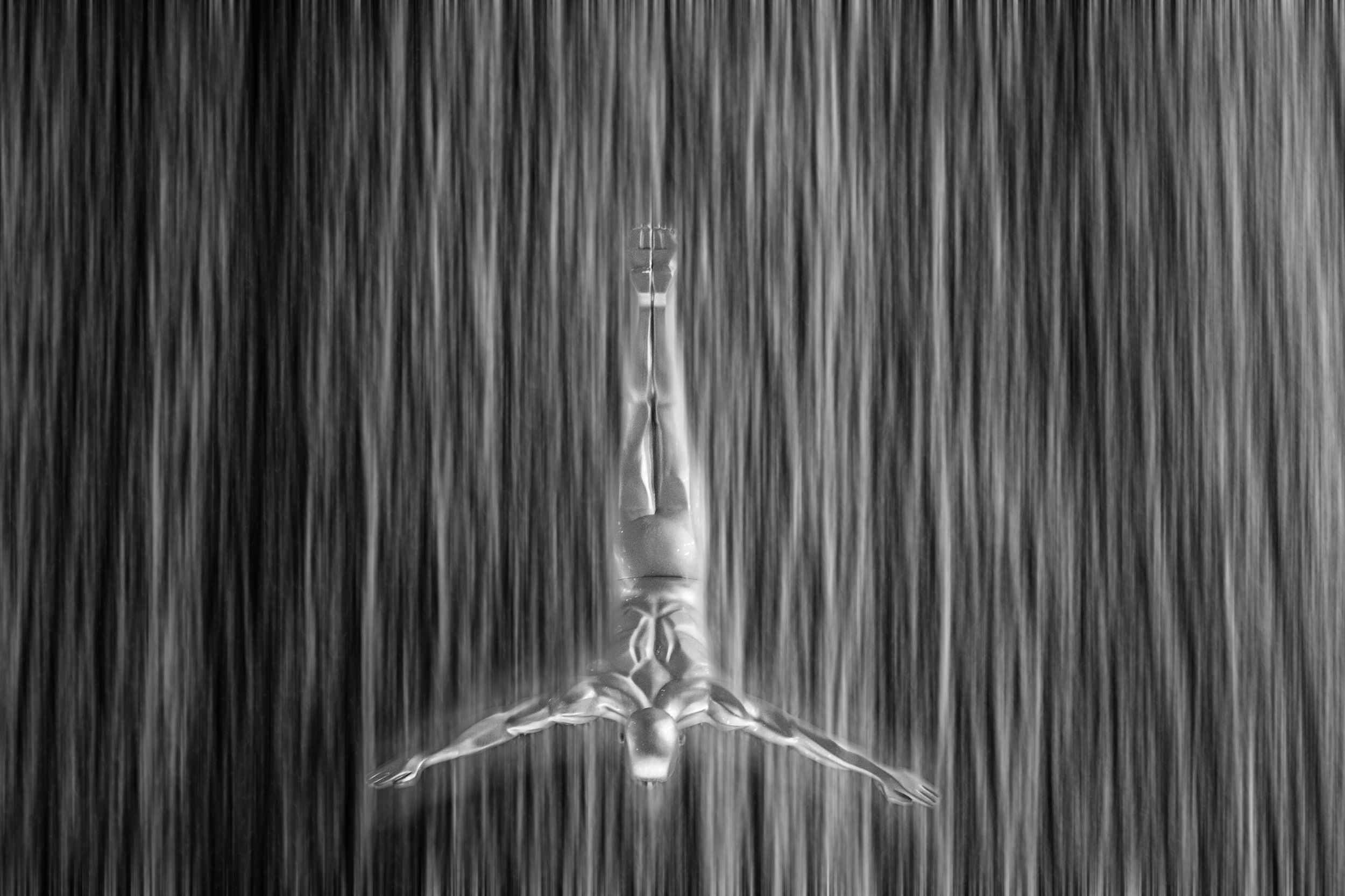 Dubai Mall - Waterfall Diver - X-T1. I didn't have a tripod, so I improvised with Photoshop in post processing :)