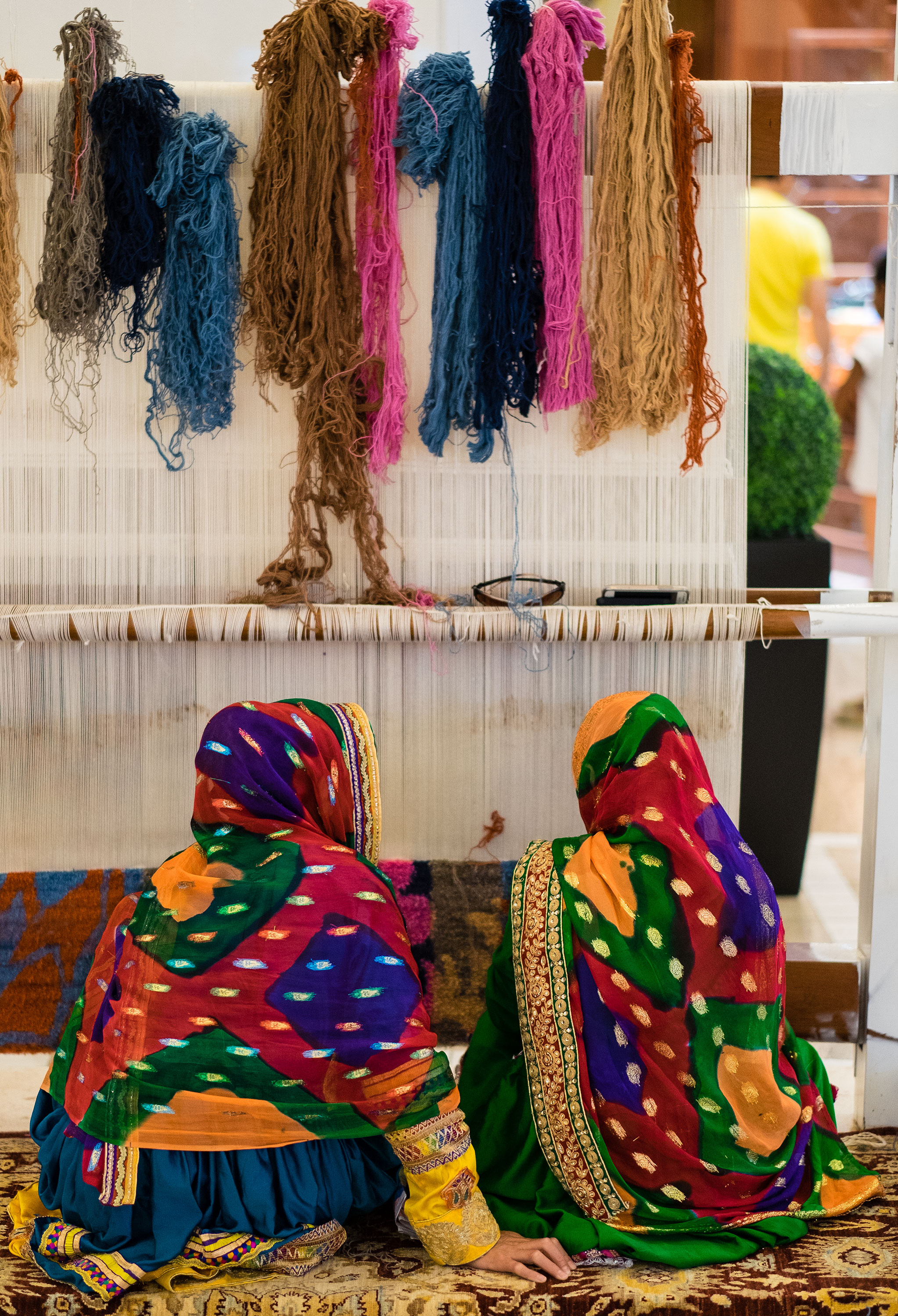 Dubai Mall - Afghani ladies weaving a carpet - X-T1. They were too shy to allow any other angle.