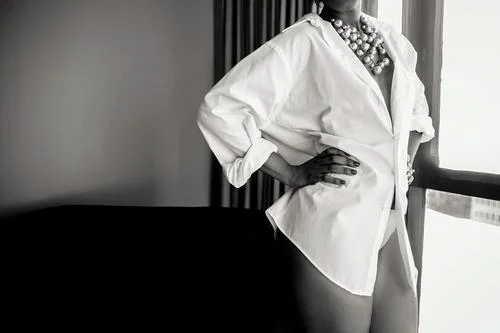 Men's sized white shirt is a little bigger for her tiny frame. I put her hand on her waist to make sure she still retained that amazing shape while keeping the look.