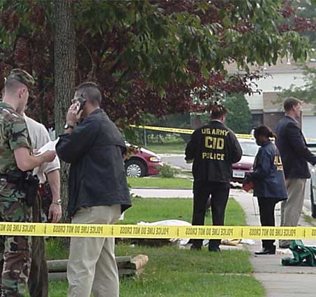 US Army CID agents at crime scene (image is in public domain)