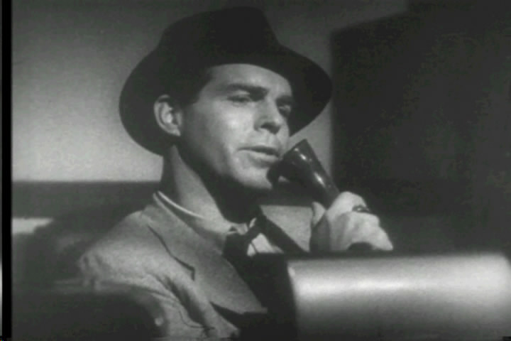 Fred MacMurray as Walter Neff, confessing into Dictaphone (Image is in public domain)