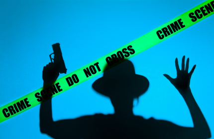Figure Behind Crime Scene Tape (image licensed by Colleen Collins)