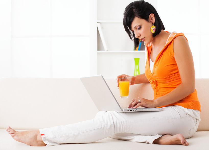 Woman writing on laptop (image licensed by Colleen Collins)