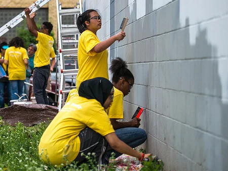 Preparing a wall for a mural.