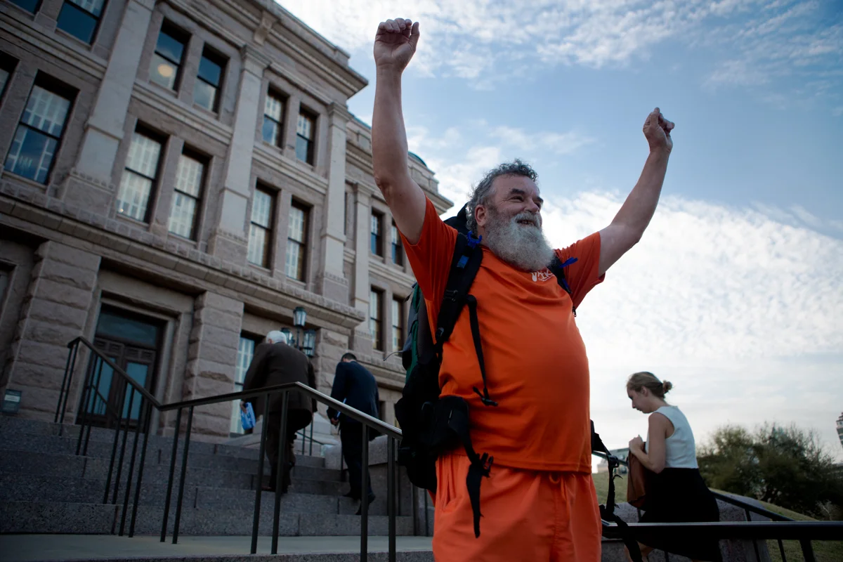 Tom Kennedy celebrates a triumphant arrival to the Texas State Capitol after spending three walks walking from Houston to Austin to raise awareness for mental health. Mar. 1, 2017.