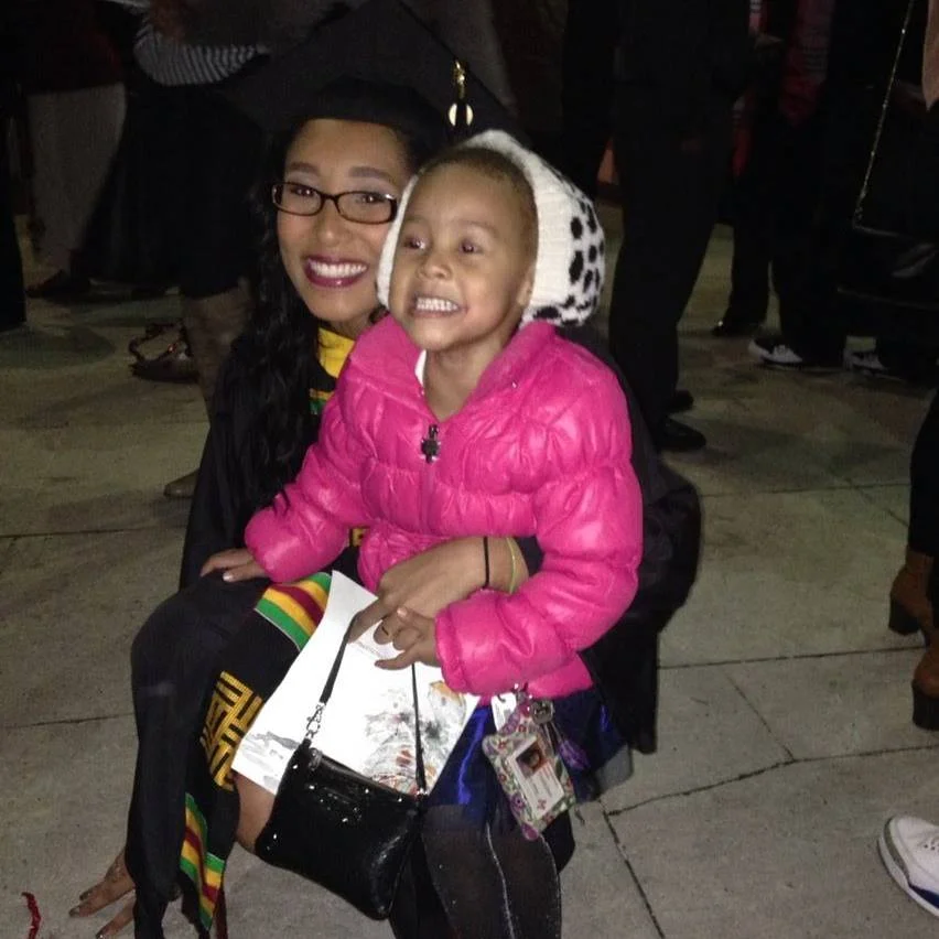 Scholar Marikit Williams with her daughter Maleah. Marikit graduated from the University of Maryland, College Park in December 2013.