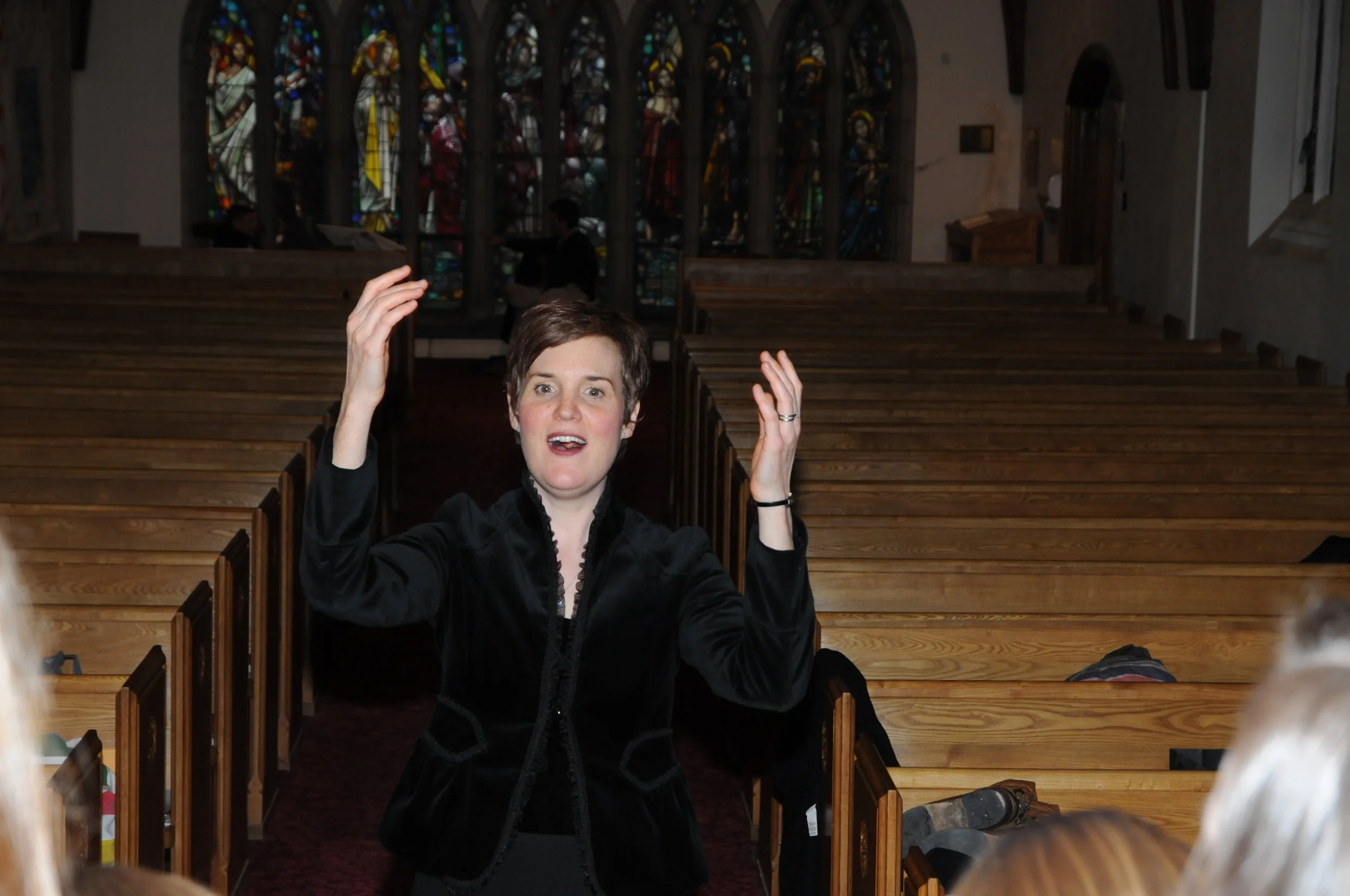 Nancy trying to get the choir to sparkle and shine in warmup