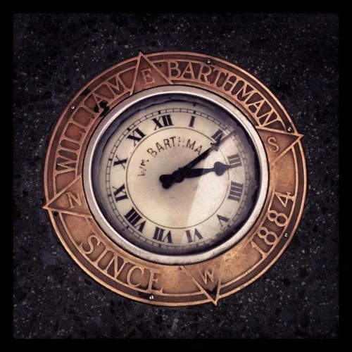 Sidewalk clock, corner of Broadway & Maiden Lane, NYC, by Kari Hansbarger.
