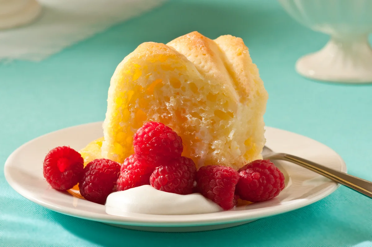 slice of savarin with cream and berries