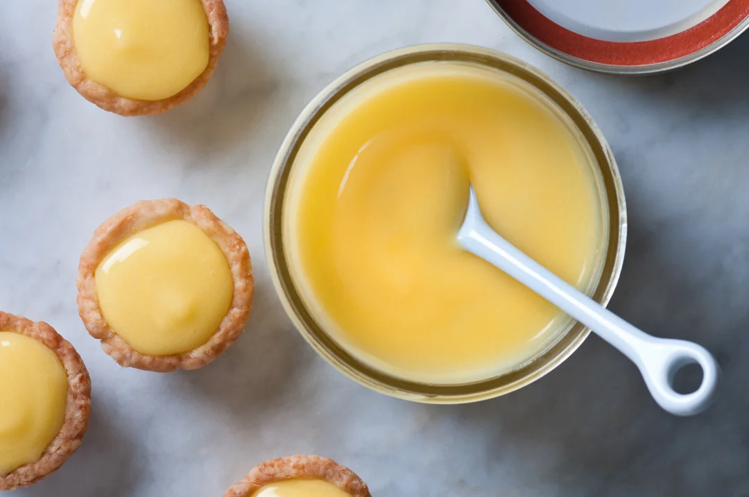 jar lemon curd with lemon tarts