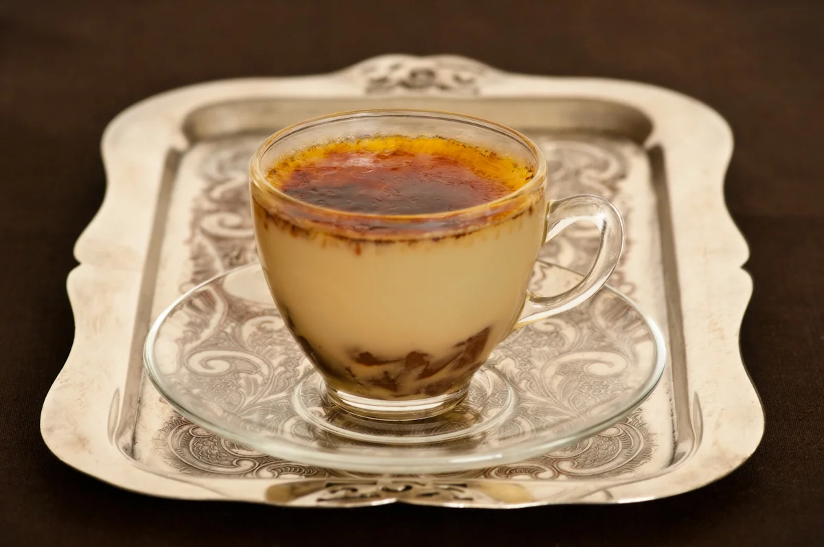 silver tray with creme brulee in espresso cup