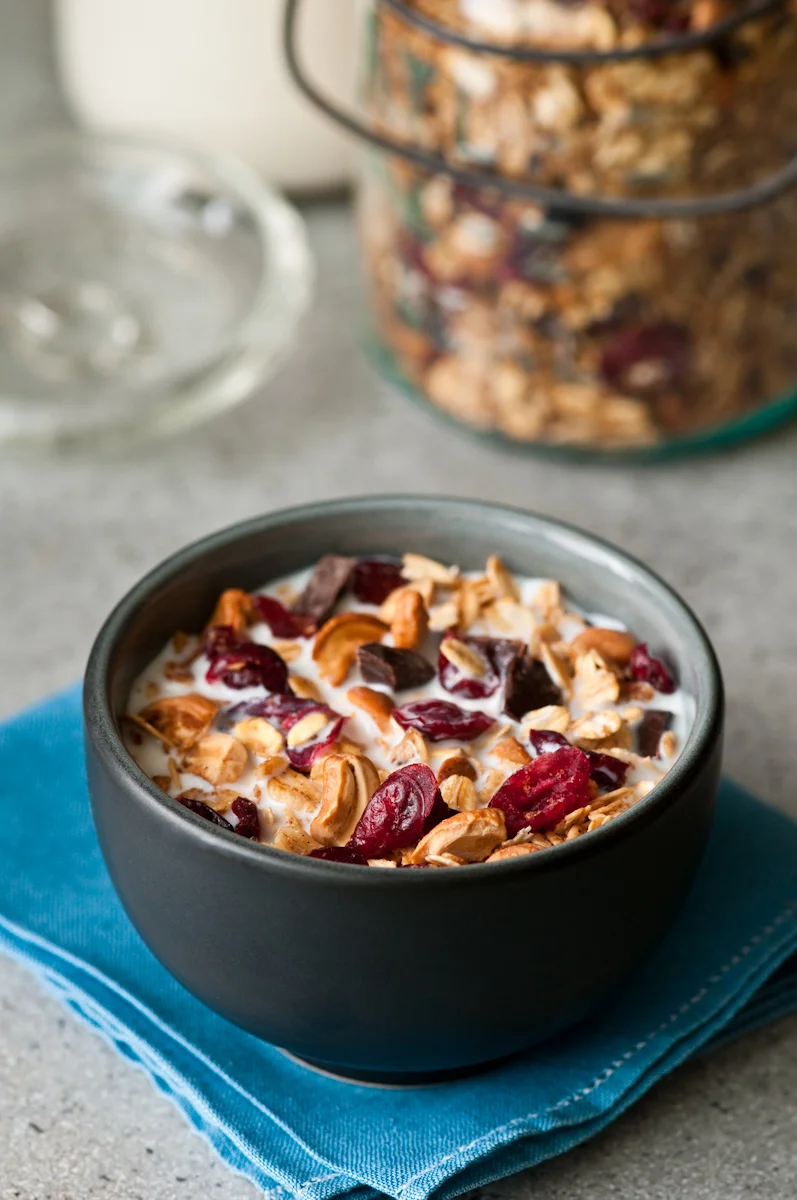 homemade granola with cranberries, cashews, dark chocolate, oats, cardamom