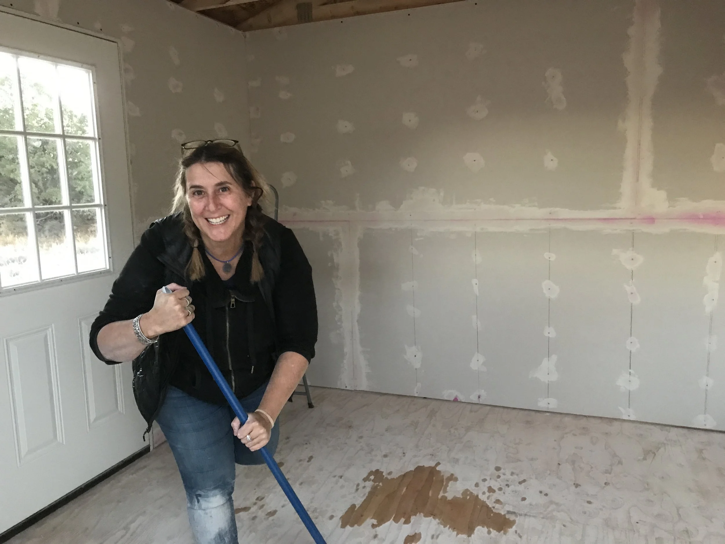 Sweeping up the drywall dust