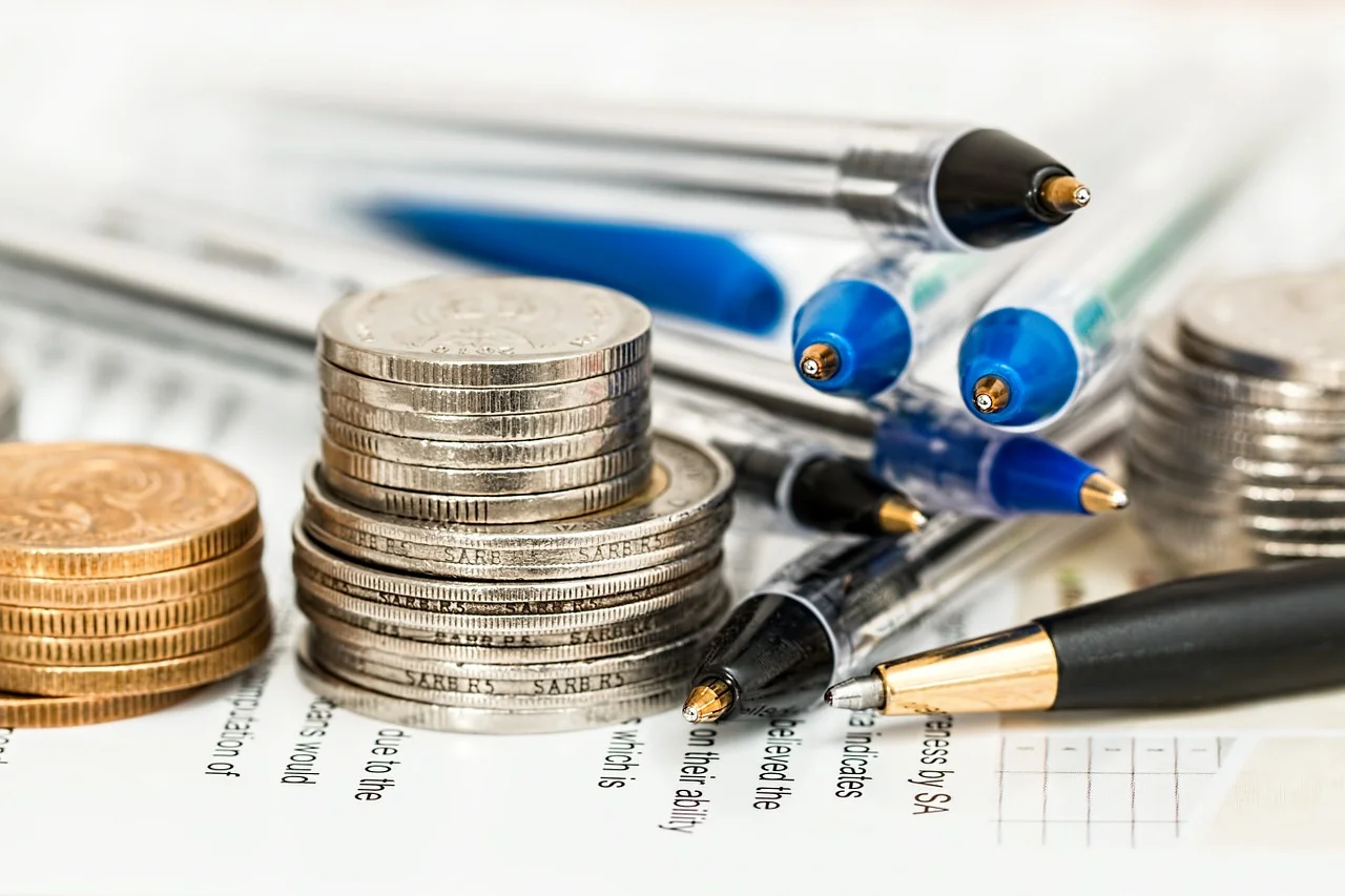 Coins with pens.jpg