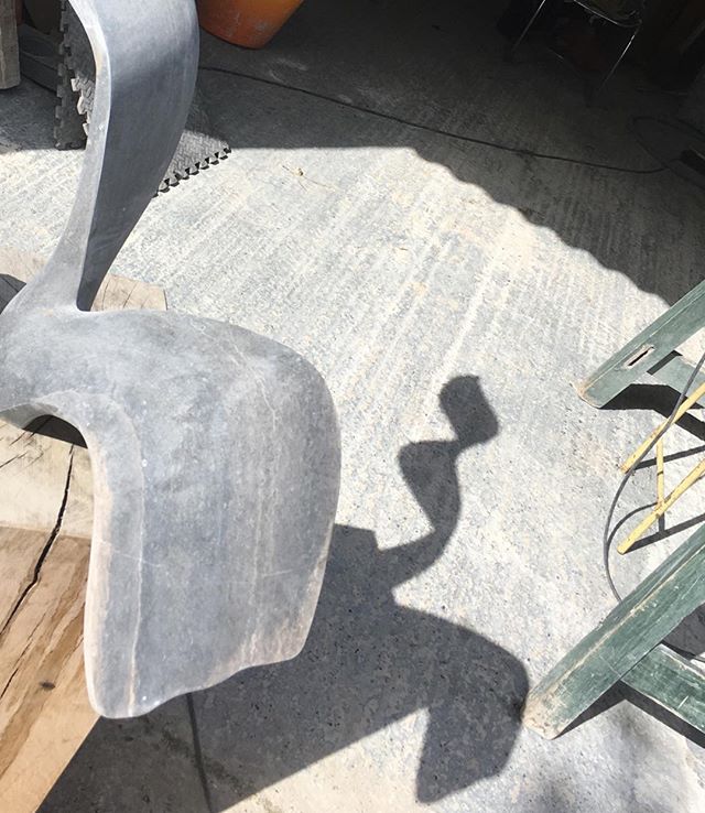 Stone an shadow. Polishing piece of very hard purbeck stone