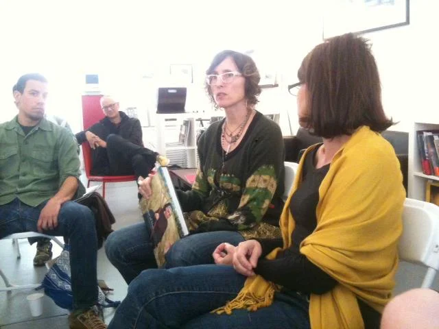 Participating in the PhotoBook Club meeting.
