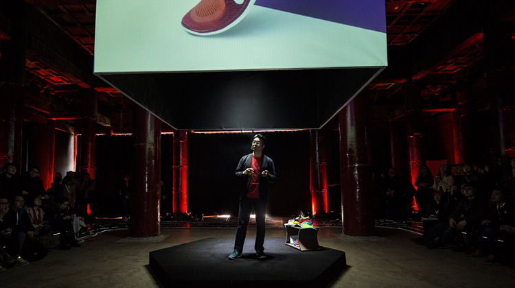 This rather dramatic photo shows me presenting at a product launch in Beijing, China, in the spring of 2014. Photo courtesy of Nike, Inc.