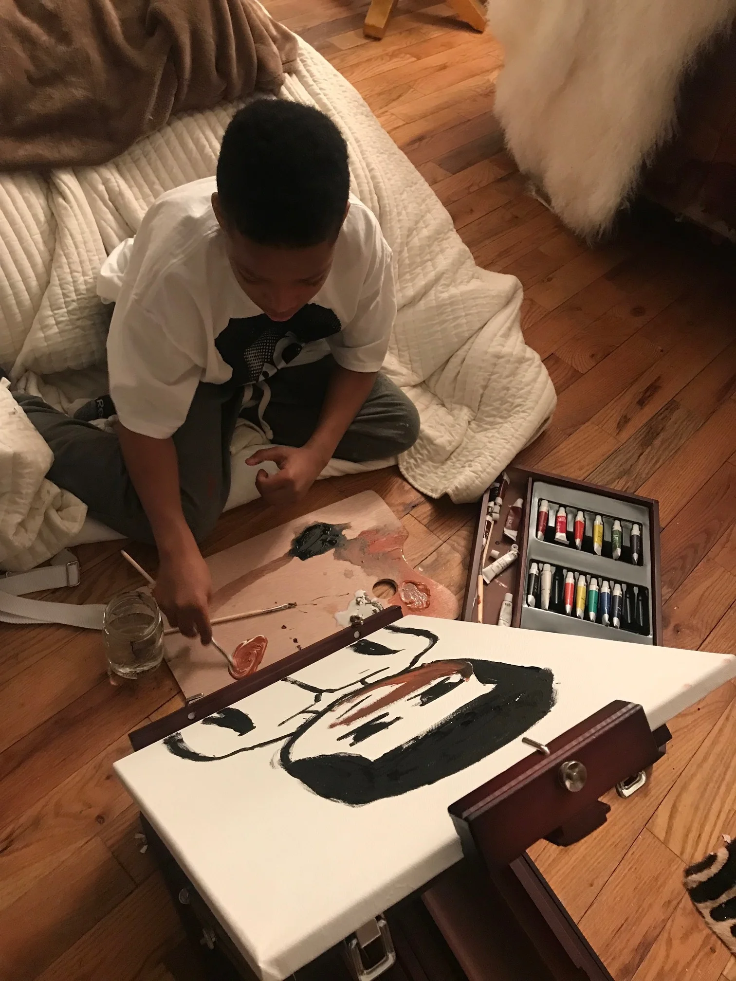 Bailey Li's son painting his self portrait
