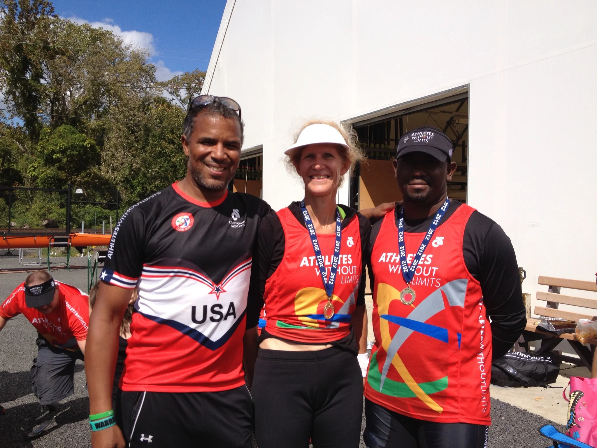 Betsy Mitchell and Keniel Martinez with AWL coach Patrick L. Johnson