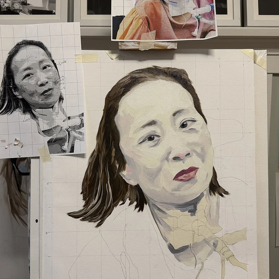 A portrait painting of a woman with shoulder-length dark hair, painted on a grid canvas, with a reference black and white photo to the left. The painting is in progress, with some areas still unpainted.
