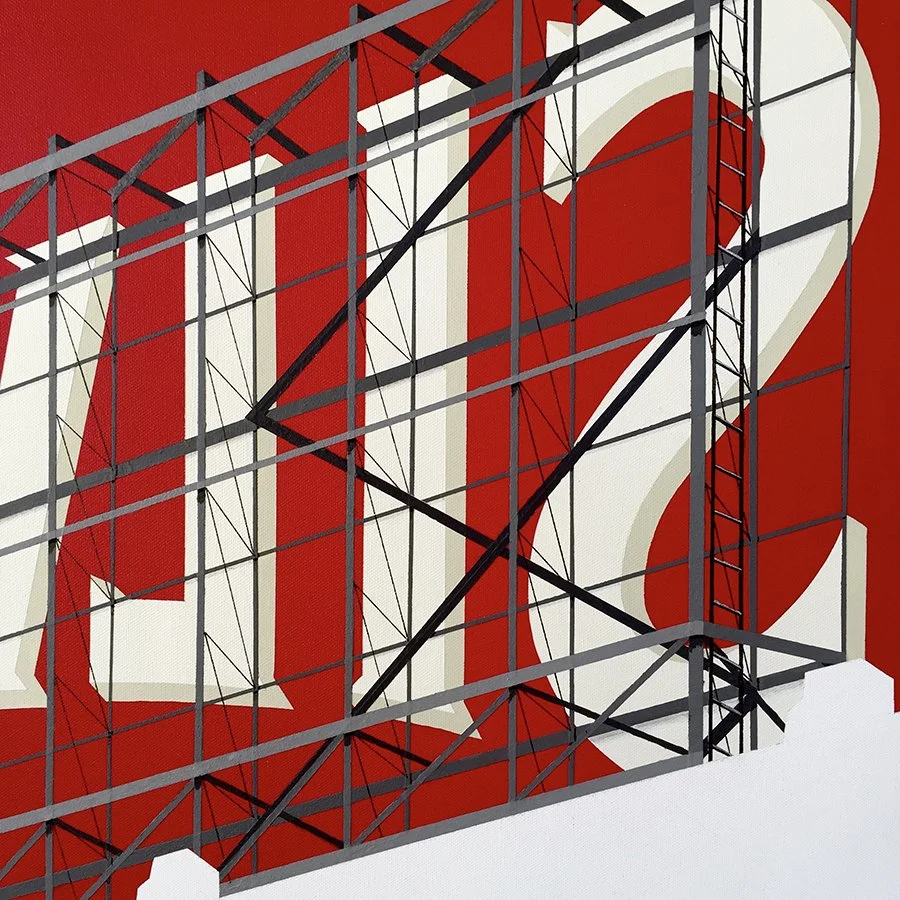 Close-up of a metal billboard structure in front of a red background with partially visible large white lettering.