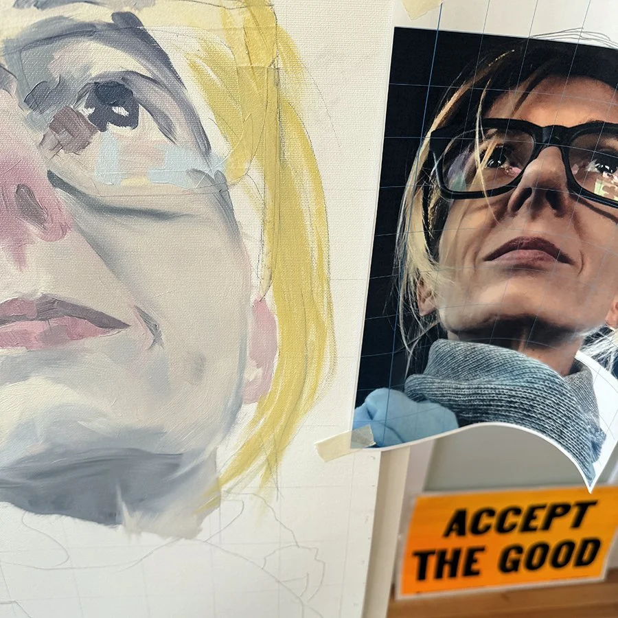 A split image showing a watercolor portrait of a woman with blonde hair and glasses on the left, and a photograph of a woman with blonde hair and glasses on the right, with an orange label reading 'Accept the Good' in front.